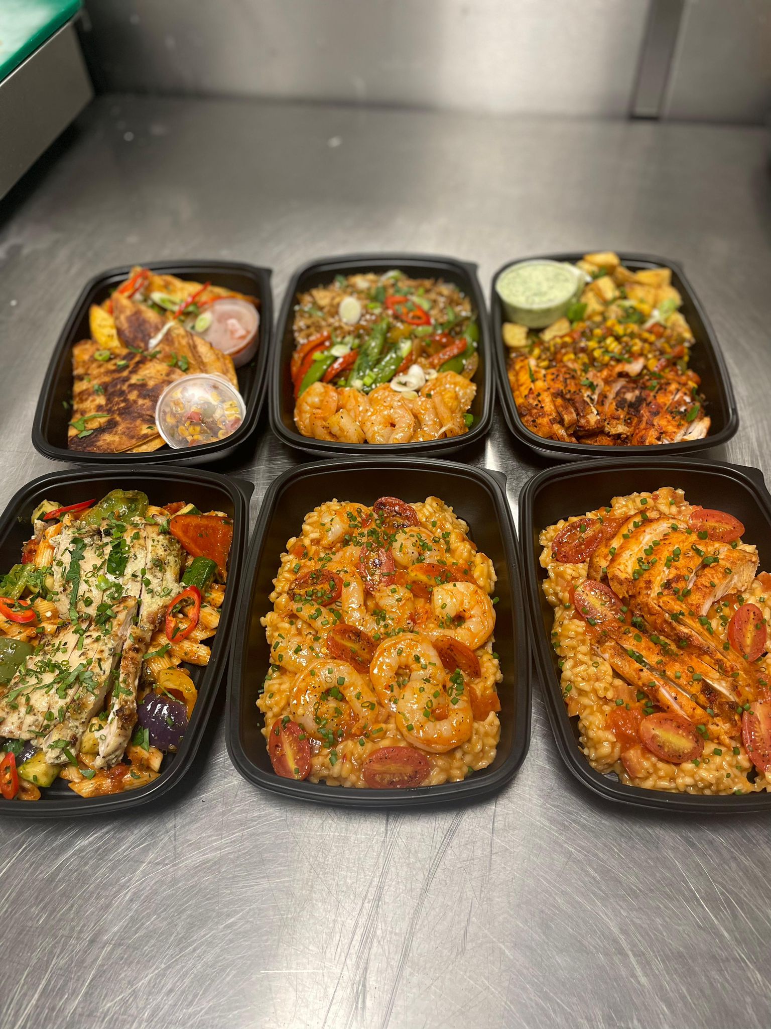 Selection of high-protein and low-carb meal prep corporate meals delivered in Newcastle upon Tyne for wellbeing and productivity