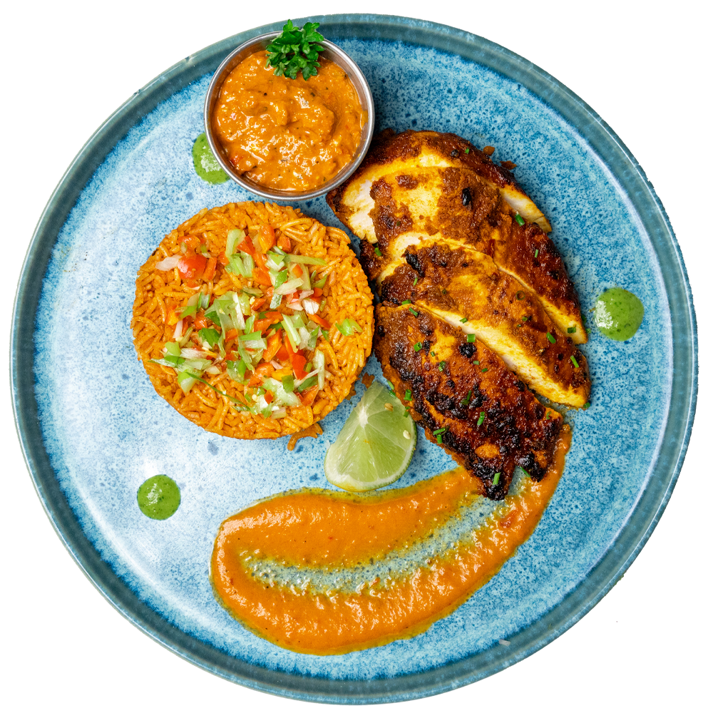 Chicken Breast with rice, sauce on a Blue plate with garnishes, low-carb ready-to-eat meal in Clacton on Sea for corporate lunchtime delivery