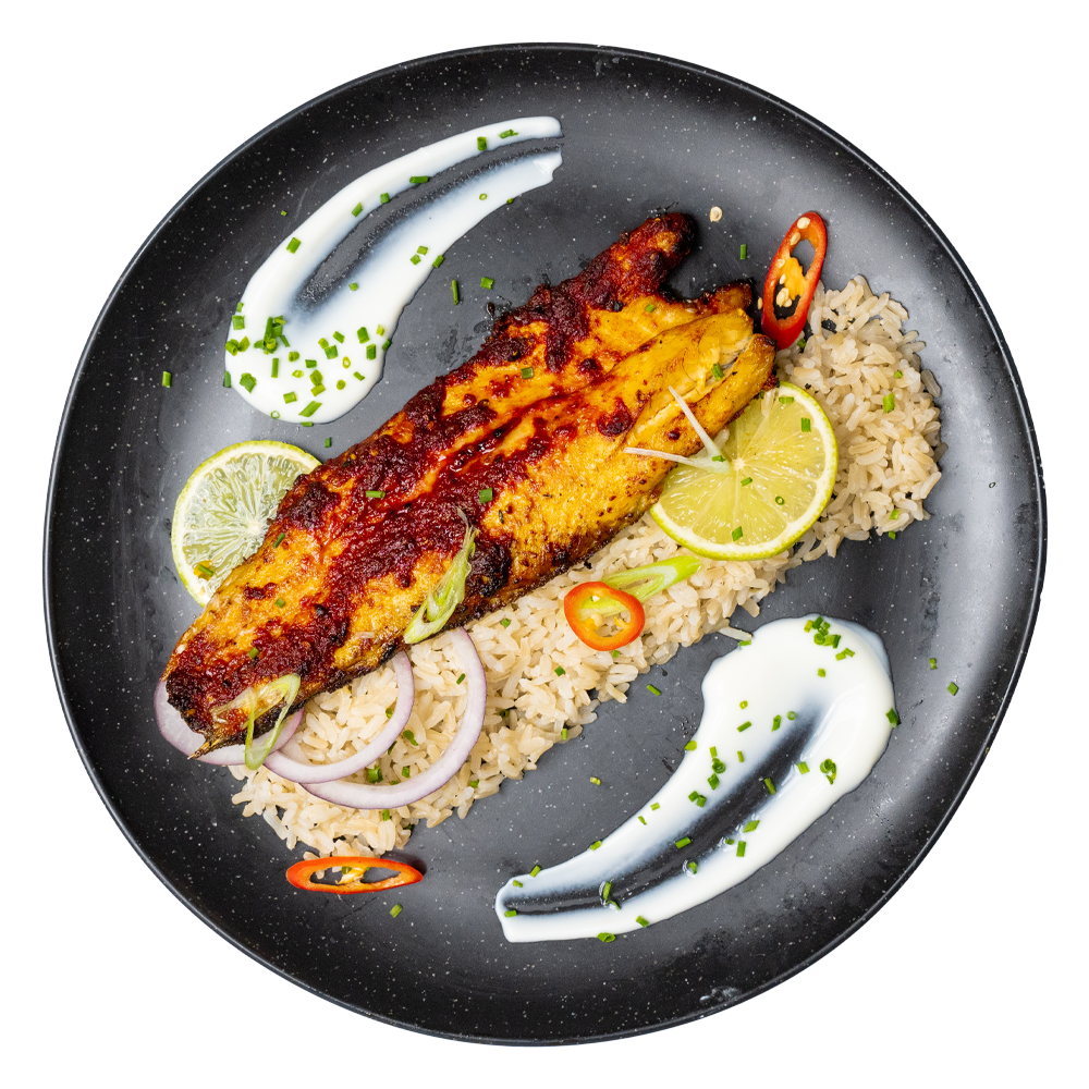 Chef-prepared healthy low-carb fish lunchtime meal with rice and garnish, corporate wellness meal delivered in Salford by Bosuprep