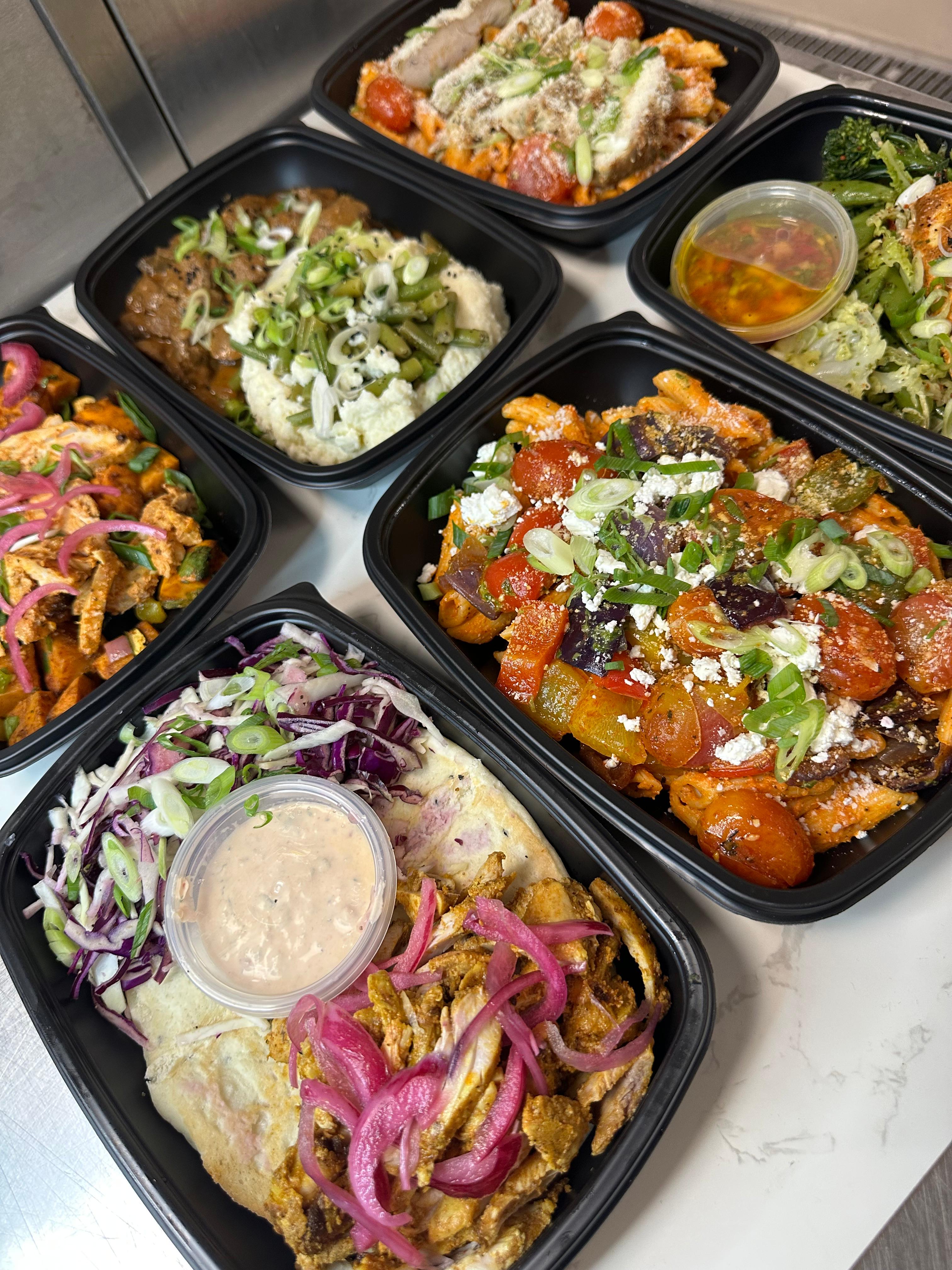 Selection of high-protein and low-carb meal prep corporate meals delivered in Lincoln for wellbeing and productivity