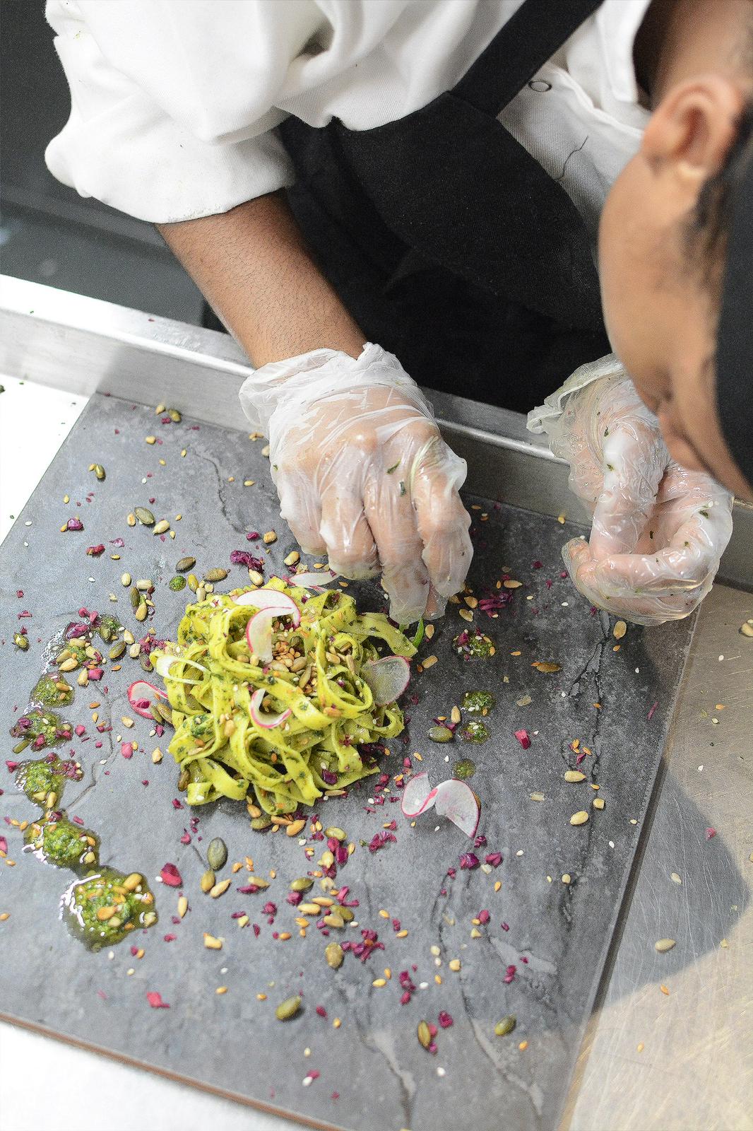 Chef-prepared corporate meal prep lunch in Bath, featuring a colourful garnish and sauce, supporting workplace wellbeing and productivity in Sheffield