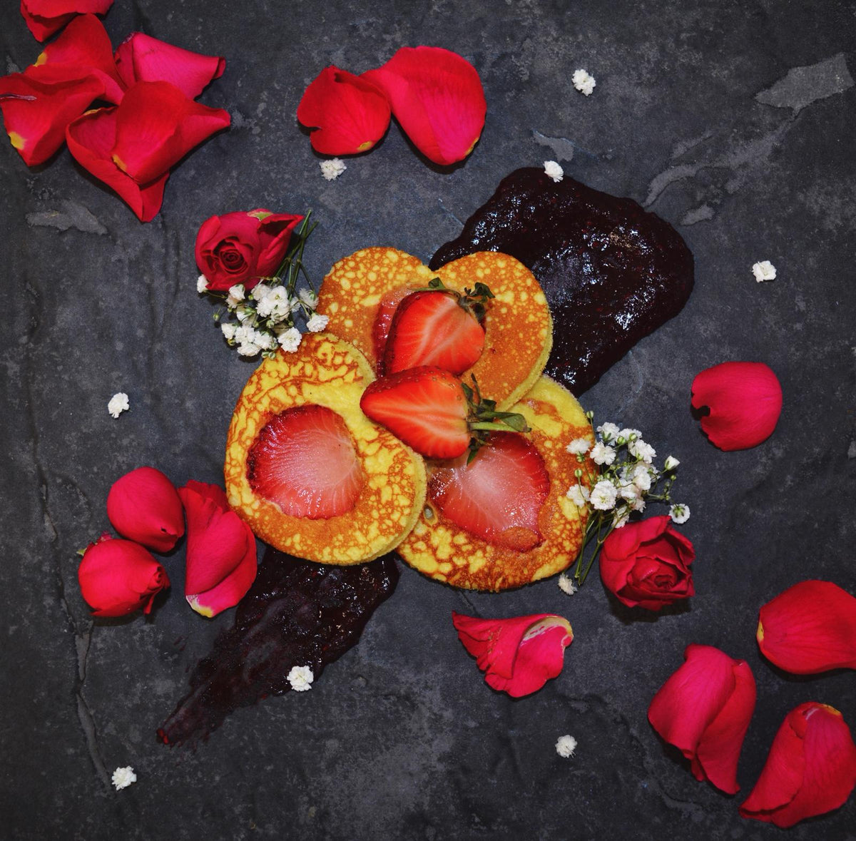 Pancakes on a plate with strawberries and garnishes, low-carb ready-to-eat meal in Swansea for corporate breakfast delivery
