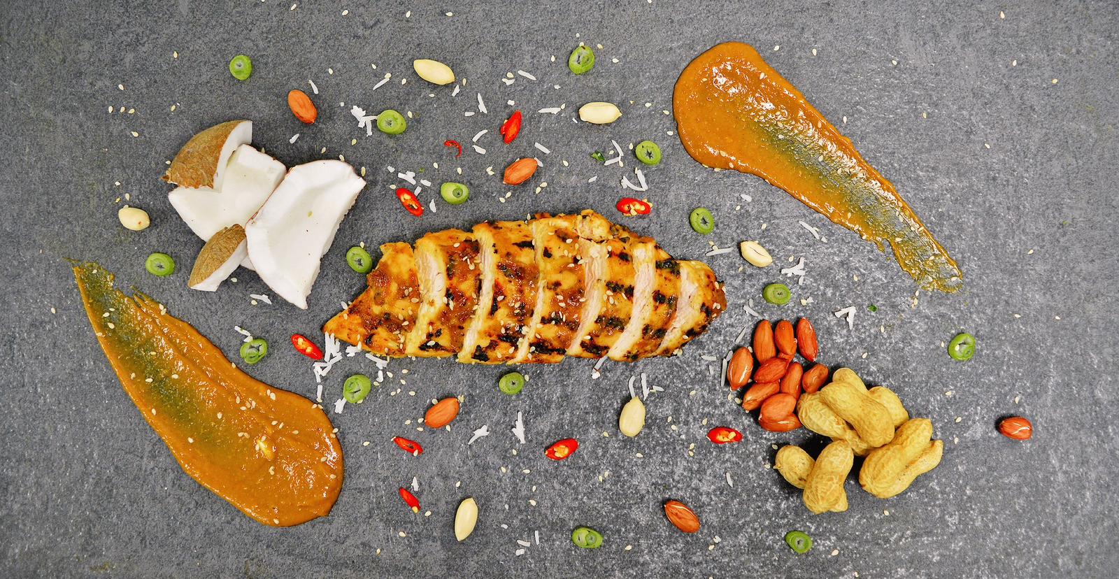 Chicken Breast on a grey plate with garnish and sauce, low-carb ready-to-eat meal in Bridgwater for corporate lunchtime delivery