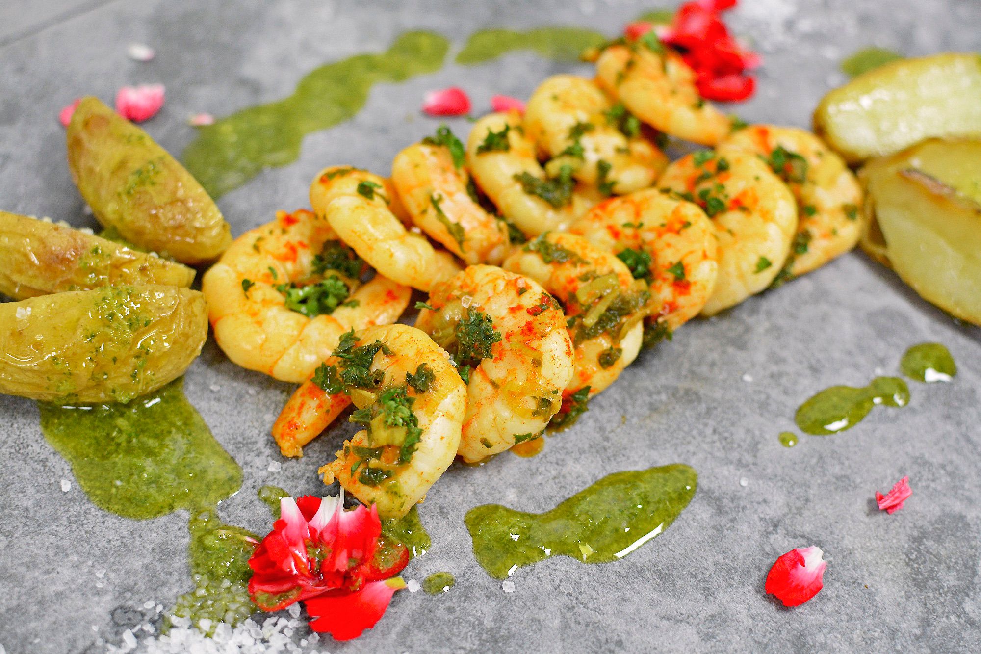 King Prawn premium meal with colourful garnish, and sauce elegantly arranged on a grey slate for Corporate Meal Prep Lunches in Stirling