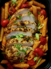 Pasta with Sliced Chicken in Creamy Sauce and cherry tomatoes